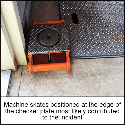 Machine skates positioned at the edge of the checker plate
