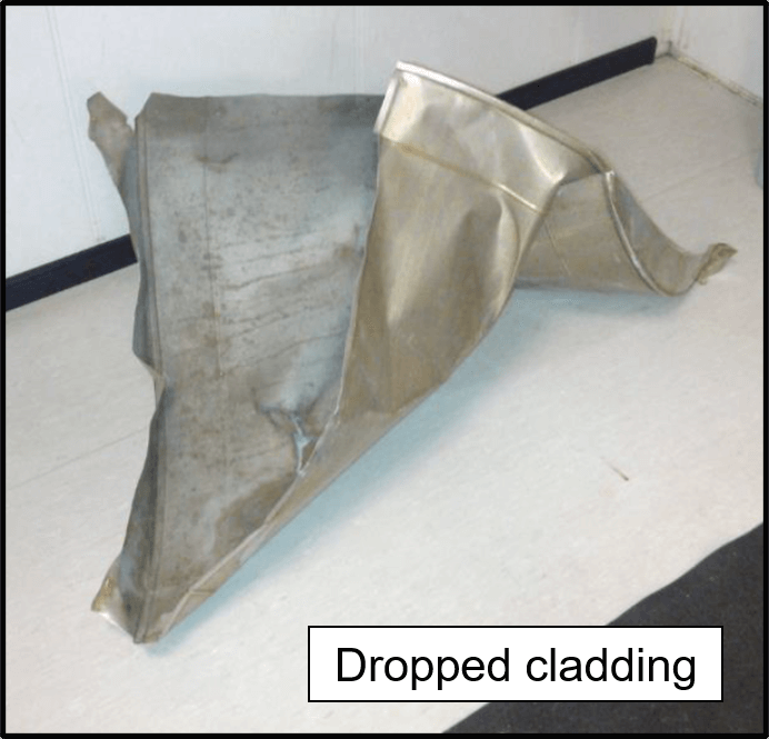 The fallen cladding. The cladding has been misshapen due to the fall. 