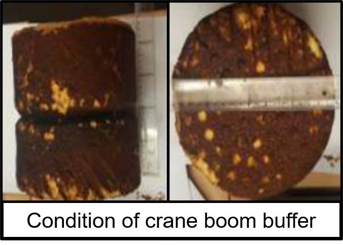 The weathered, deteriorated boom buffer.