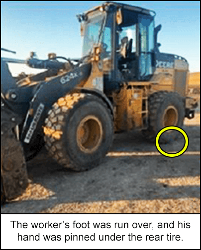 The worker's foot was run over, and his hand was pinned under the rear tire