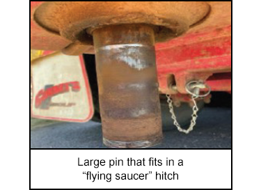 Large pin that fits in a “flying saucer” hitch