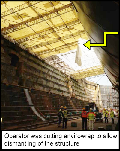 The dry dock where the operator had been working. A section of cut away envirowrap hanging from the ceiling. 