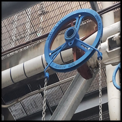 A blue chain wheel and chain secured in place.