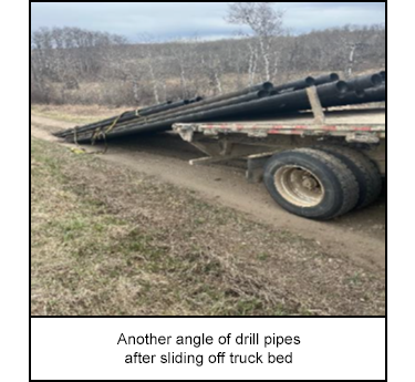 Another angle of drill pipes after sliding off truck bed