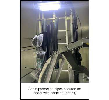 1205-s1.png Cable protection pipes secured on ladder with cable tie (not ok)