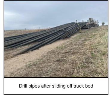 Drill pipes after sliding off truck bed