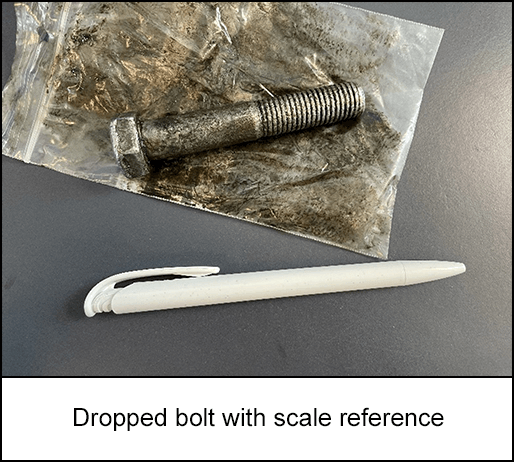 Dropped bolt next to a pen for scale reference