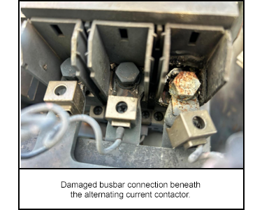 Damaged busbar connection beneath the alternating current contactor.