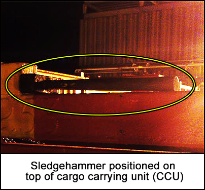 Sledgehammer positioned on top of cargo carrying unit (CCU)