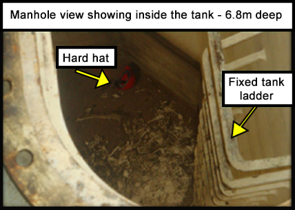 Manhole view showing inside a 6.8 metre deep tank confined space.