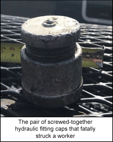 The pair of screwed-together hydraulic fitting caps that fatally struck a worker 