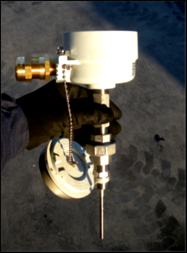 A worker holding the disconnected head of the temperature probe