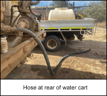 Hose at rear of water cart