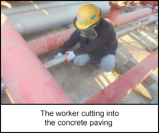 1218-s1.png The worker cutting into the concrete paving
