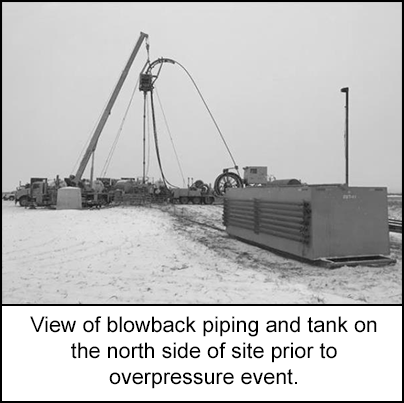 View of blowback piping and tank on the north side of site prior to overpressure event. 