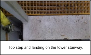 Top step and landing on the tower stairway.