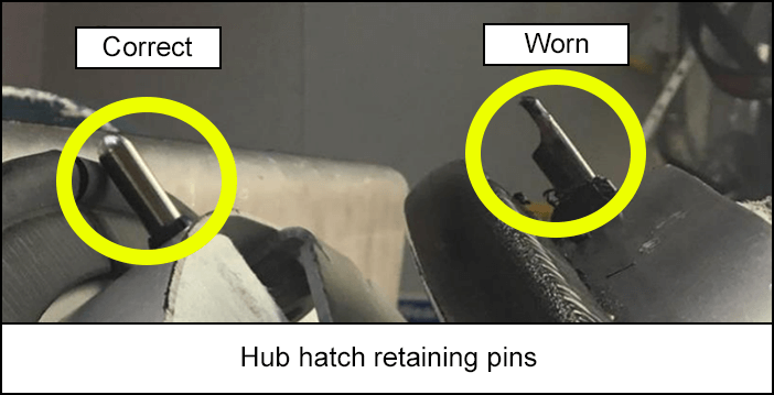 Hub hatch retaining pins