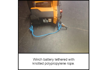 Winch battery tethered with knotted polypropylene rope.