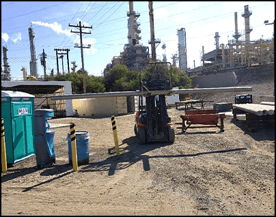 Forklift moving a cement line piping